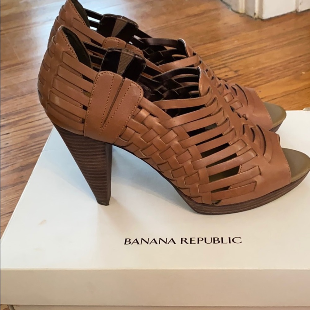 Open toe high heel shoe boot with cut out detail.